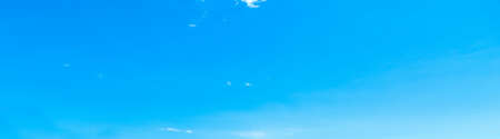 blue sky with white, soft cloudsの写真素材