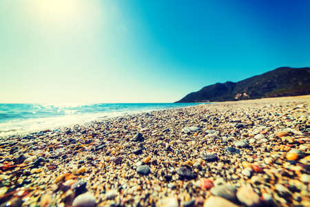 Pebbles by the shore in Perdepera beach. Sardinia, Italyの写真素材