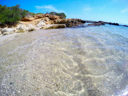 Clear water and white sand in Sardinia, Italyの写真素材