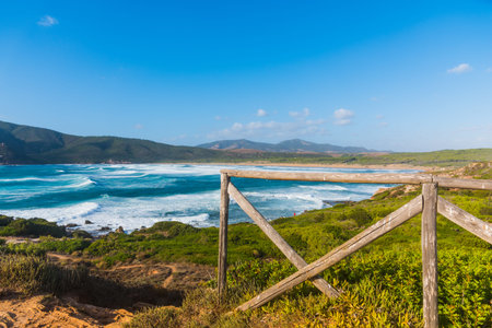 Wooden fence by the sea in Porto Ferro. Sardinia, Italyの写真素材