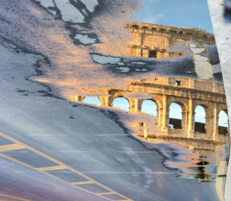 World famous Coliseum reflected on a pond. Rome, Italy. Upside down viewの写真素材