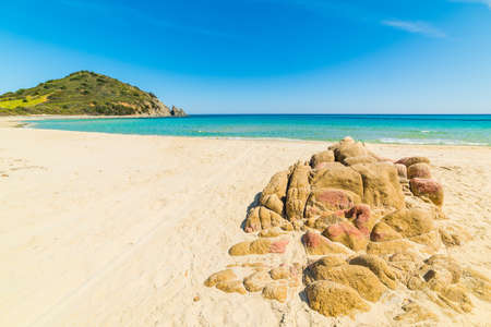 Rocks and sand in Cala Monte Turno, Sardiniaの写真素材
