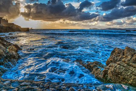 Rocky shore at sunset in Sardinia, Italyの写真素材