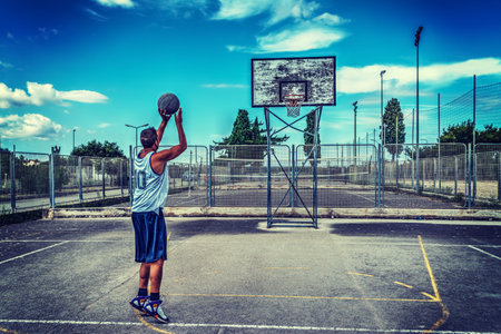 Jump shot in a playground. HDR effect