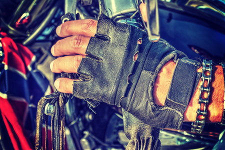 Close up of biker gloves in vintage tone effectの写真素材