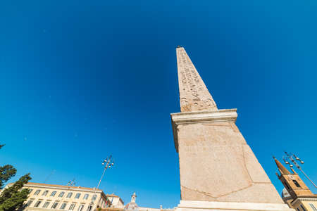 Flaminio obelisk in Piazza del Popolo under a blue sky. Rome, Italyの写真素材