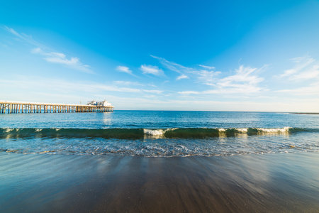 Small wave by the pier in Malibu beach. Los Angeles, Californiaの写真素材
