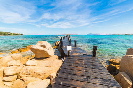 Wooden pier in Romazzino beach, Costa Smeralda. Sardinia, Italyの写真素材