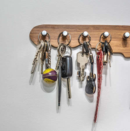 Key holder with keys hanging on the wallの写真素材
