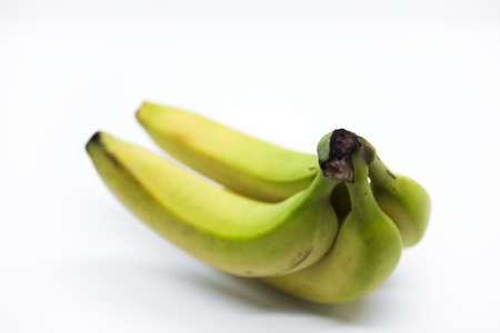 Four bananas isolated on white backgroundの写真素材