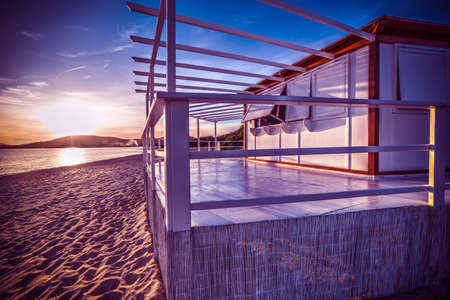 Wooden terrace by the sea at sunset. Sardinia, Italyの写真素材