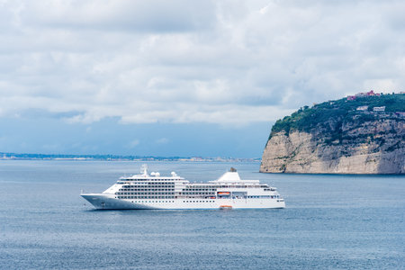 Cruise ship by Sorrento coast on a cloudy day. Amalfi coast, Italy
