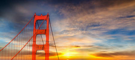 Colorful sky over world famous Golden Gate bridge in San Francisco at sunset. California, USAの写真素材