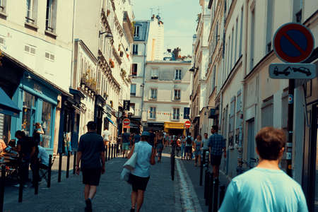 Paris, France - July 07, 2018: People in a narrow alley in Montmartreのeditorial素材