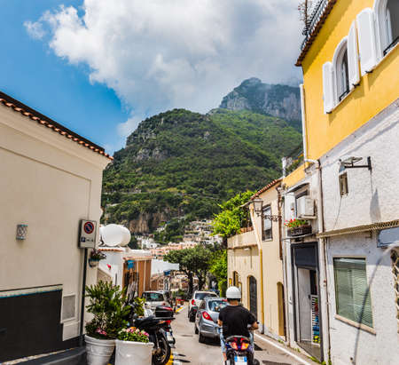 Traffic on a picturesque street in Positano. Amalfi coast, Italyの写真素材