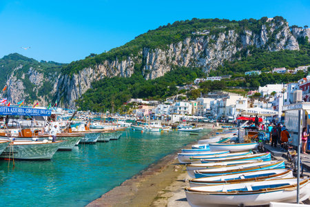 Capri, Italy - May, 25 2018: Boats and tourists in Capri harborのeditorial素材