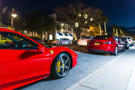 Naples, USA - February, 26, 2019: Red Ferrari parked on 5th avenue in Naplesのeditorial素材