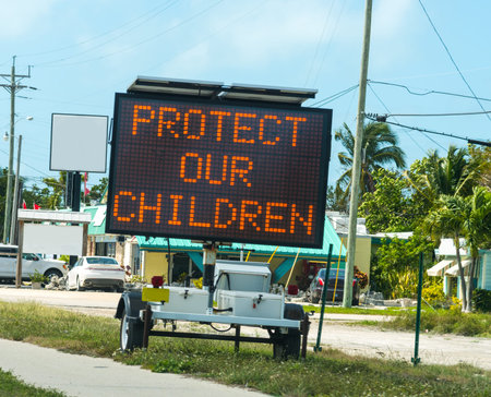 Protect our children sign on the edge of the road in Florida Keysの写真素材