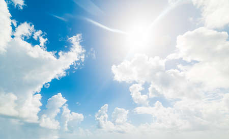 blue sky with white, soft cloudsの写真素材