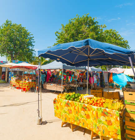 Guadeloupe, FR - February 17, 2019: Fruits and souvenirs stands in Guadeloupe, French west indies. Lesser Antilles, Caribbean seaのeditorial素材