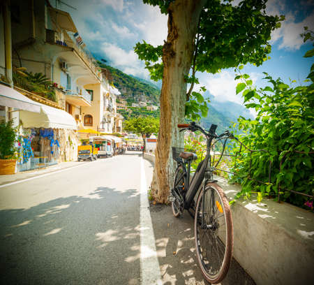 Bike parked in beautiful Positano seafront. Amalfi coast, Italyの写真素材