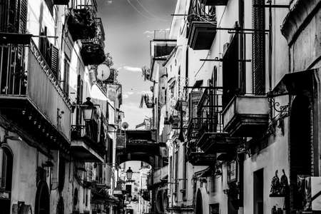 Picturesque narrow alley in world famous old town Amalfi, Italy. Black and white effectの写真素材