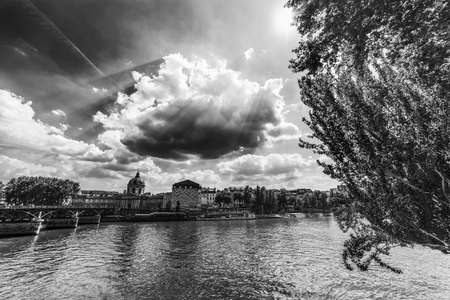Institut de France seen from Seine river in Paris, France. Black and white effectの写真素材