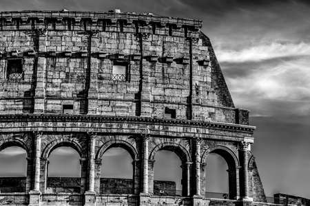 Detail of world famous Coliseum at sunset, Italy. Black and white effectの写真素材