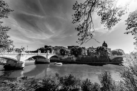 Tiber river in Rome on a sunny day, Italy. Black and white effectの写真素材