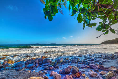 Rocky shore in Grande Anse beach in Guadeloupe, French west indies. Lesser Antilles, Caribbean seaの写真素材