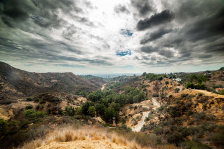 Dark clouds over Bronson Canyon, Los Angeles. California, USAの写真素材
