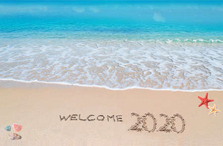 welcome 2020 written on a tropical beachの写真素材