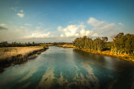 Cloudy sky over Calik lagoon at sunset. Sardinia, Italyの写真素材