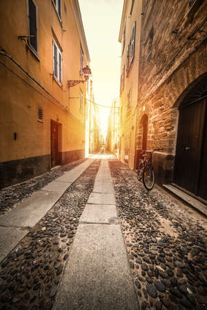 Narrow alley in old town Alghero. Sardinia, Italyの写真素材