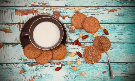 Almond milk, peanut butter and whole grain cookies seen from aboveの写真素材