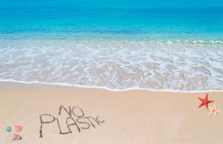 Close up of "no plastic" written on a tropical beachの写真素材