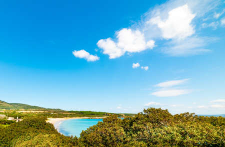 Small clouds over Lazzaretto beach on a spring day. Sardinia, Italyの写真素材