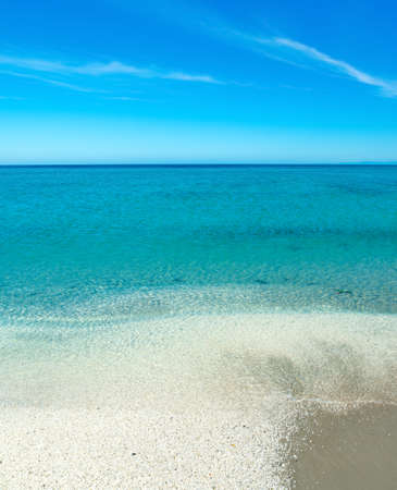 White pebbles and blue sea in Le Saline beach in Stintino. Sardinia, Italyの写真素材