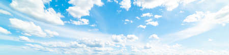 blue sky with white, soft cloudsの写真素材