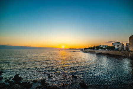 Clear sky over Alghero at sunset. Sardinia, Italyの写真素材