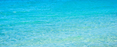 Detail of turquoise water in Le Bombarde beach in Sardinia, Italyの写真素材