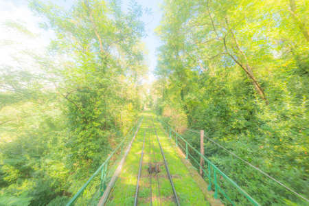 Funicular railway in Montecatini surrounded by green vegetation. Tuscany, Italyの写真素材