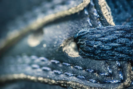 Extreme close up of blue shoelace and seamsの写真素材