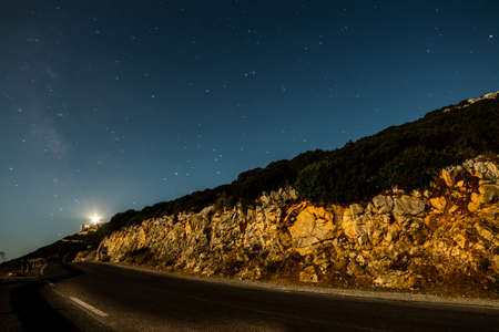 Starry sky over a country road in Sardinia, Italyの写真素材