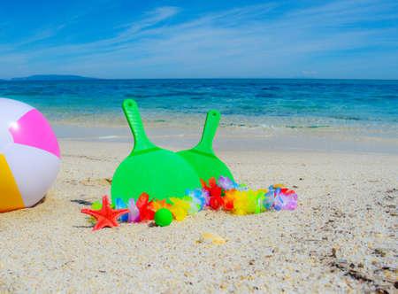Green rackets on the beach in summertimeの写真素材