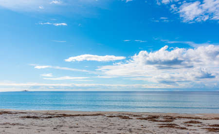 Blue sky with clouds over Maria Pia beach in Alghero. Sardinia, Italyの写真素材
