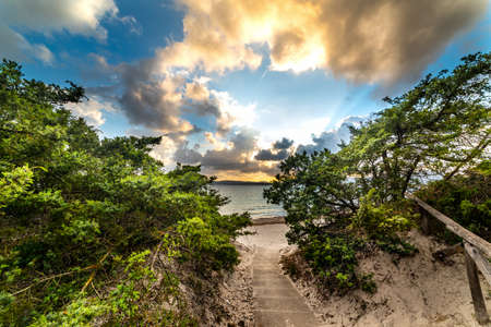 Walkpath to the sea in Maria Pia beach at sunset. Alghero, Italyの写真素材