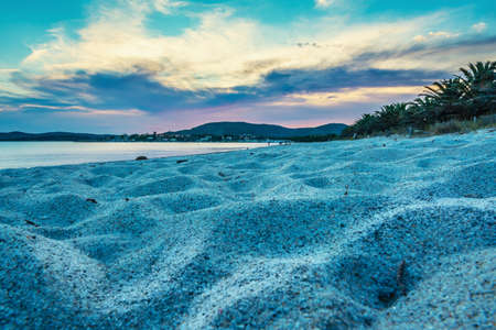 White sand in Maria Pia beach at sunset. Sardinia, Italyの写真素材