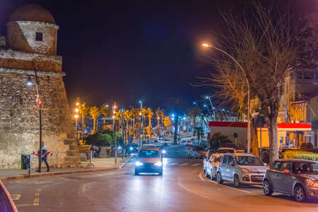 Traffic in Alghero sea front at night. Sardinia, Italyの写真素材