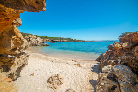 Rocks by the sea in a small cove in Alghero. Sardinia, Italyの写真素材